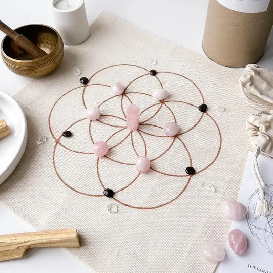 Crystal grid with rose quartz stones arranged in a sacred geometric pattern for love, healing, and emotional balance